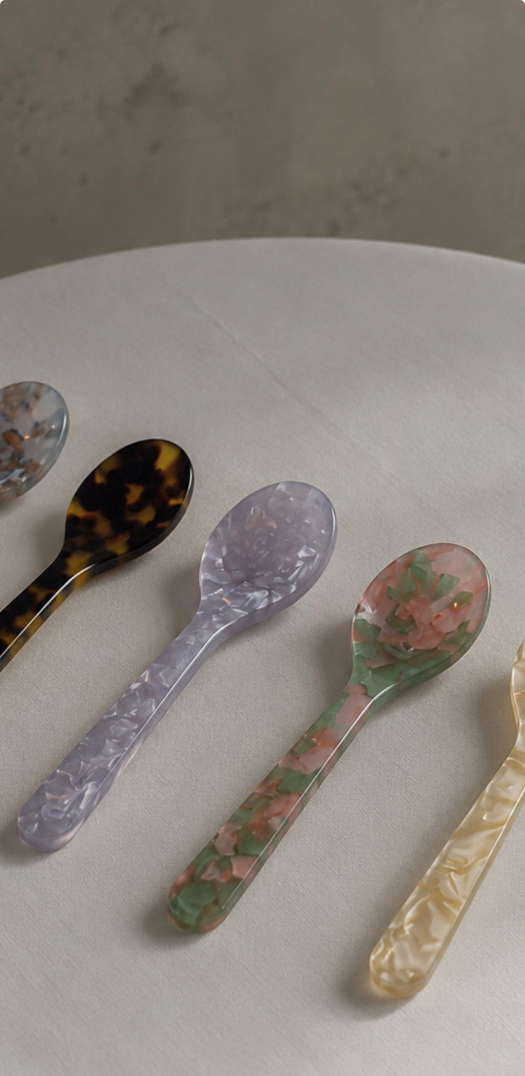 Handmade acrylic dessert spoons in marbled tortoiseshell, lavender, floral and cream