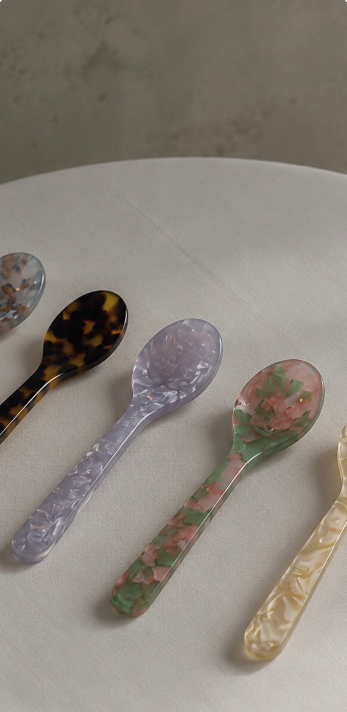 Handmade acrylic dessert spoons in marbled tortoiseshell, lavender, floral and cream