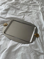 Ornate silver serving tray with shell handles
